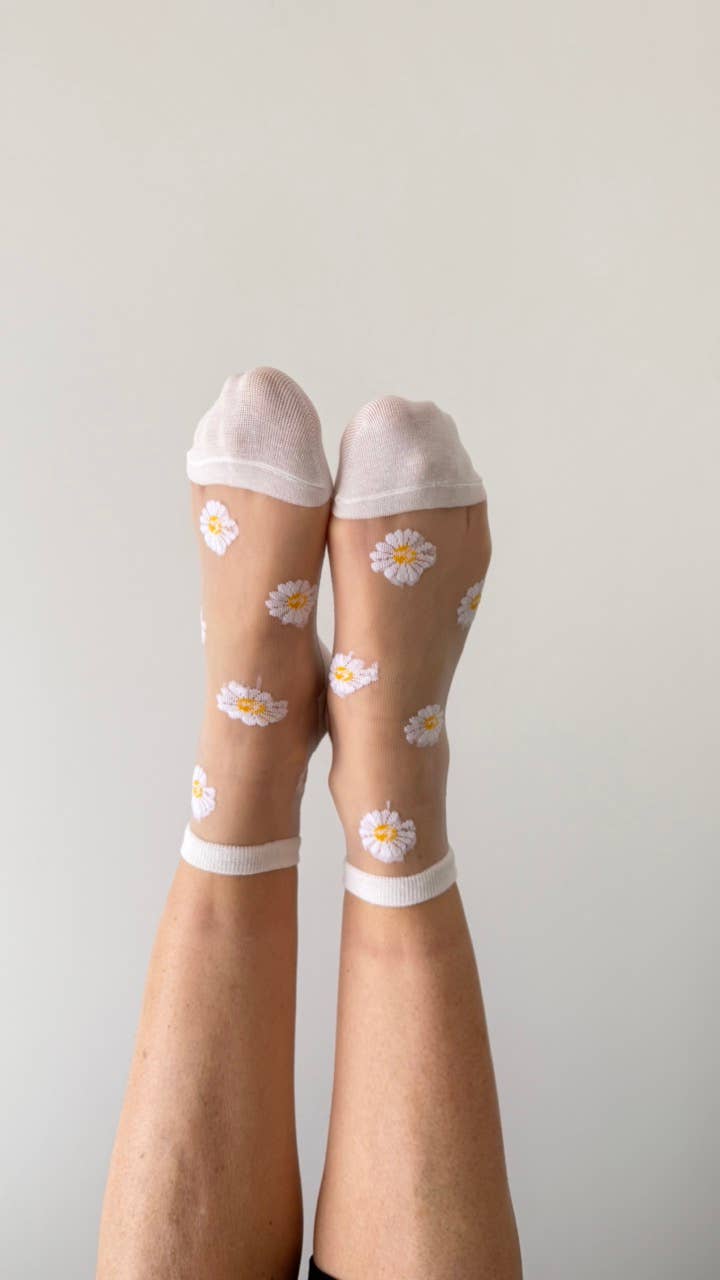 Flora - Chaussettes transparentes marguerites bordures blanches