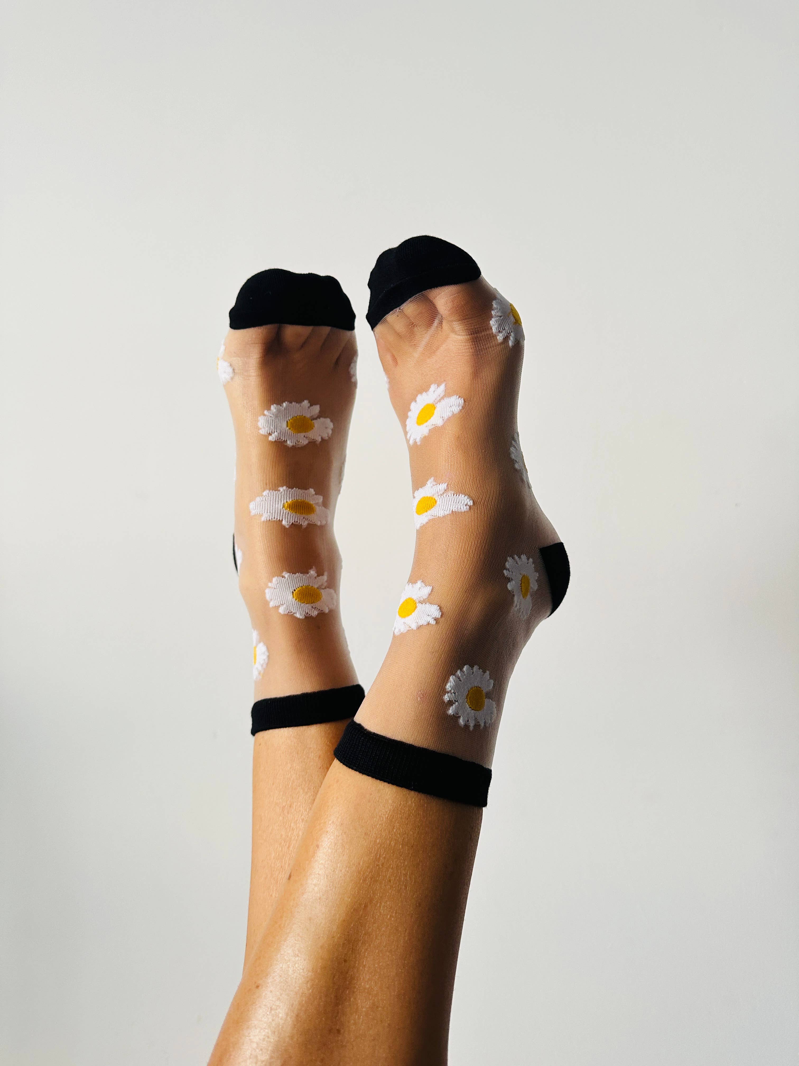 Flora - Chaussettes transparentes marguerites bordures noires